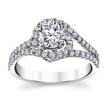 White gold engagement ring with diamond mounting and diamond center