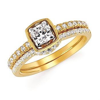 yellow gold engagement ring with diamonds around the band and a large center diamond