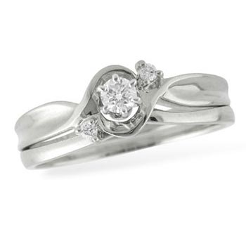 white gold engagement ring with center diamond and unique shape